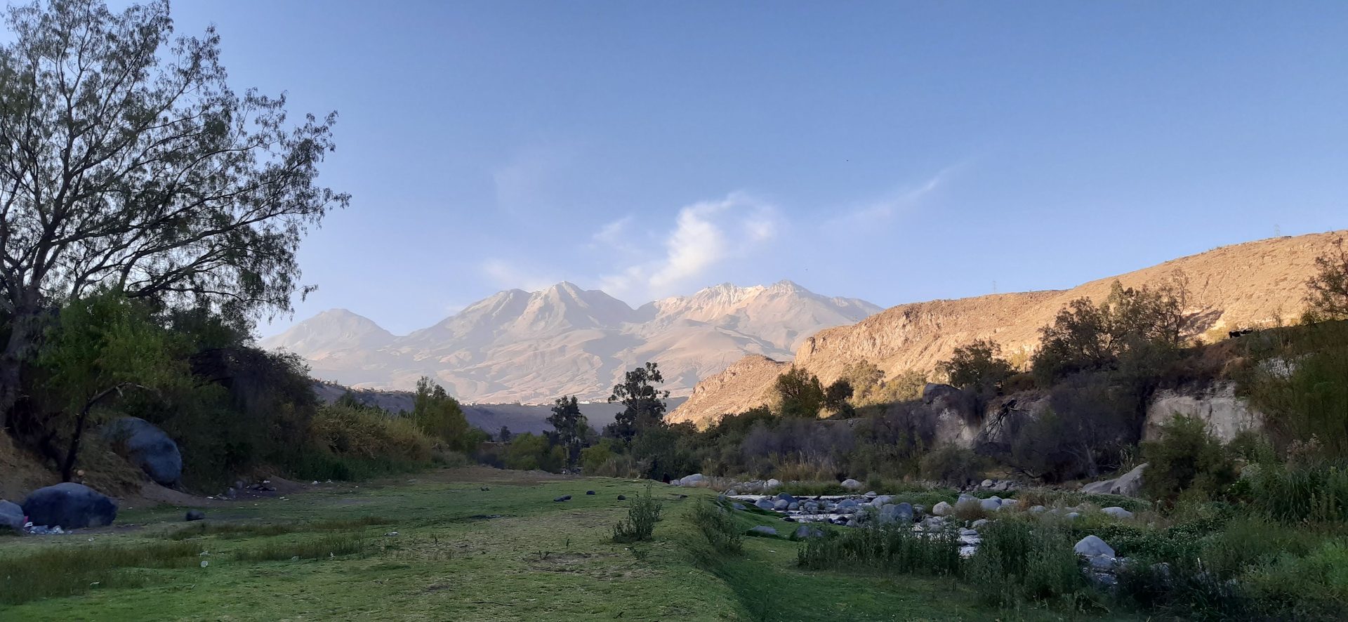 Golden-hour light washing over the terraced fields of the Chilina Valley