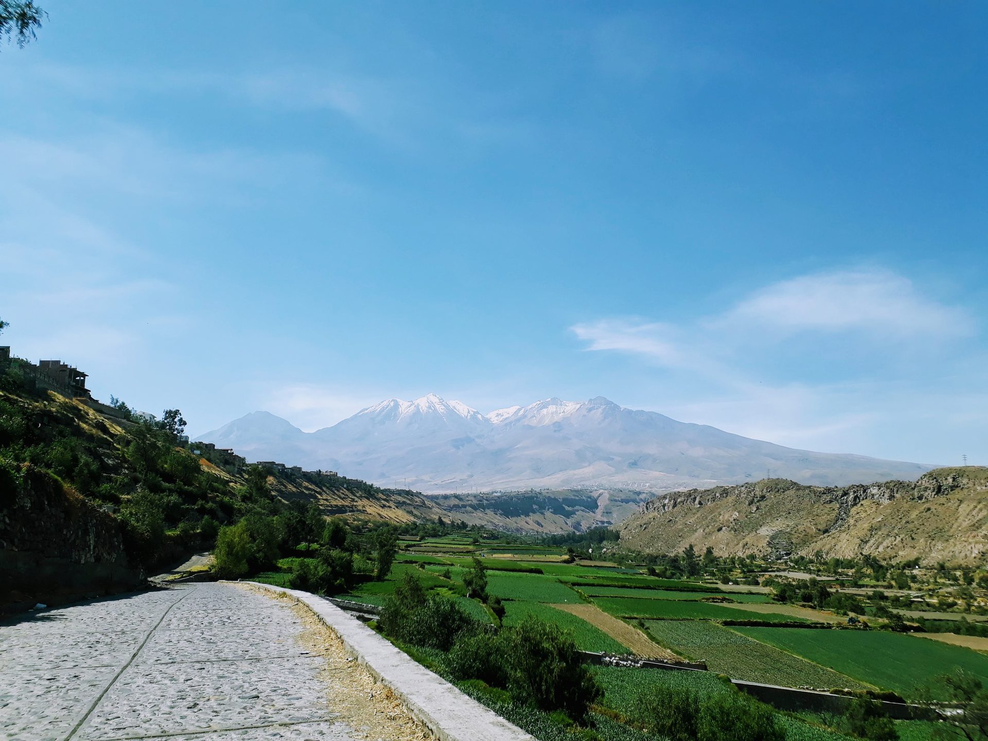 Green farming terraces of the Chilina Valley stretching toward Misti volcano